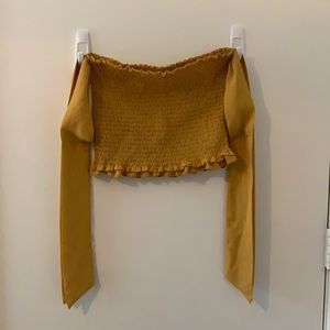 Strapless mustard yellow crop top with arm bands/ribbons. Size M.